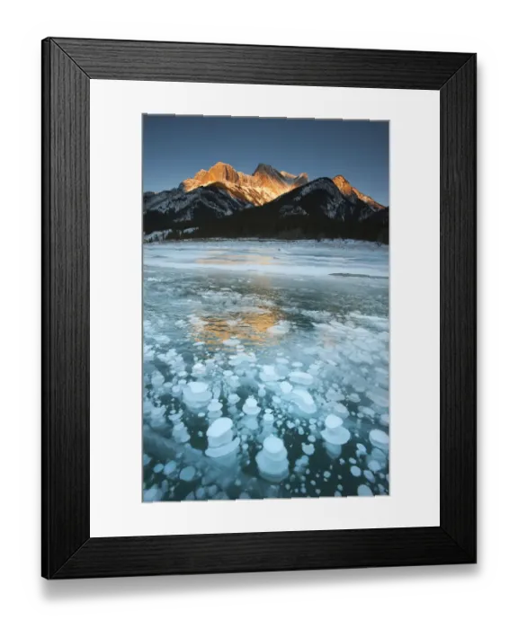Framed Print : Mountains and frozen gas bubbles beneath surface of frozen lake, Abraham Lake, Canadian Rockies Framed Print : Mountains and frozen gas bubbles beneath surface of frozen lake, Abraham Lake, Canadian Rockies