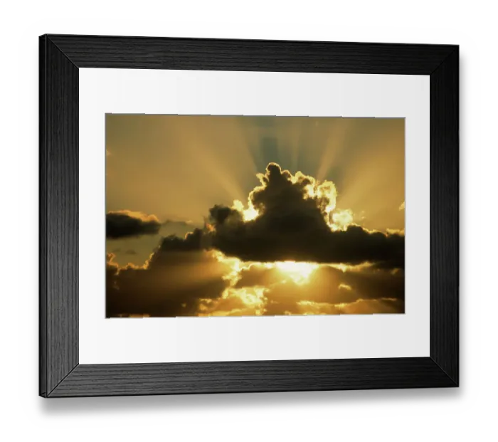 Framed Print : Sun rays beam from behind cumulus clouds Framed Print : Sun rays beam from behind cumulus clouds