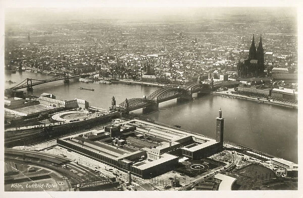 Aerial View of Cologne, Germany, featuring the Hohenzollern Bridge over the River Rhine