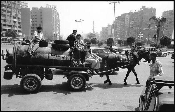 Horse drawn vehicle in Cairo traffic, Egypt. Date: 1980s