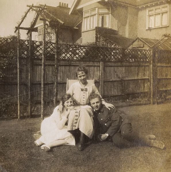 Soldier with fiancee and her mother in a garden, WW1