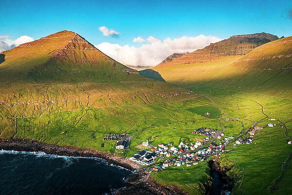 Aerial view of the coastal village of Gjogv and mountains at sunrise, Eysturoy Island, Faroe Islands, Denmark, Europe
