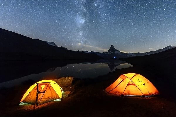 Camping under the stars with Matterhorn reflected in Lake Stellisee, Zermatt, Canton of Valais