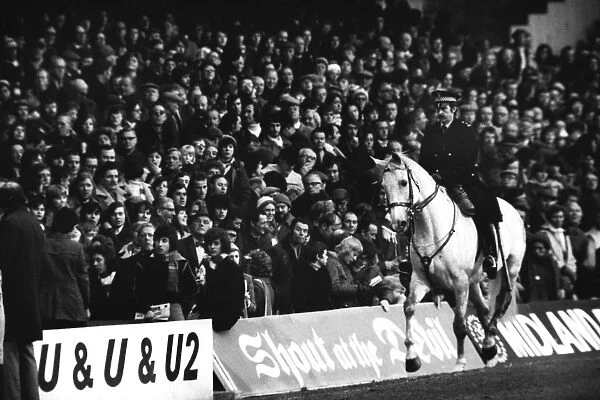 A mounted policeman patrols the touchline during the 1976 FA Cup tie between Chelsea and Crystal Palace