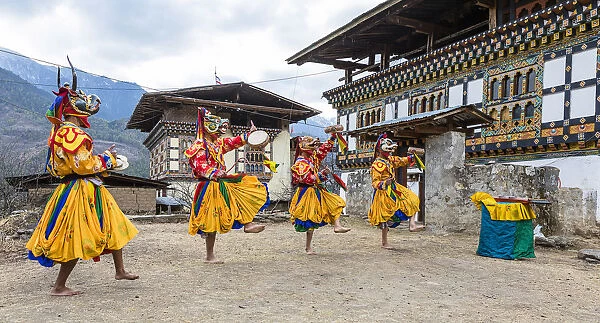 Masked dancers at a local festival in Paro District, Bhutan