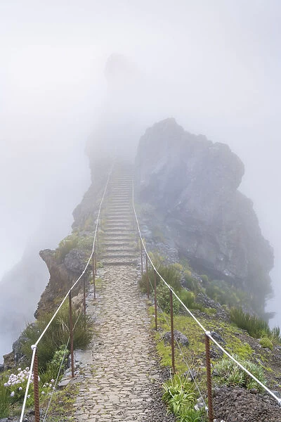 Staircase in the mist on the trail at Pico do Areeiro. Funchal, Madeira Island, Portugal