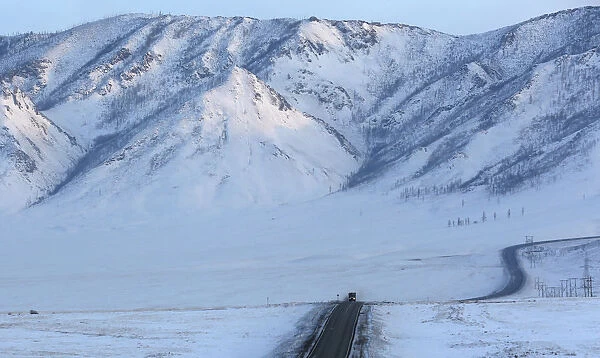 A truck drives along the R257 federal highway in the Republic of Tuva