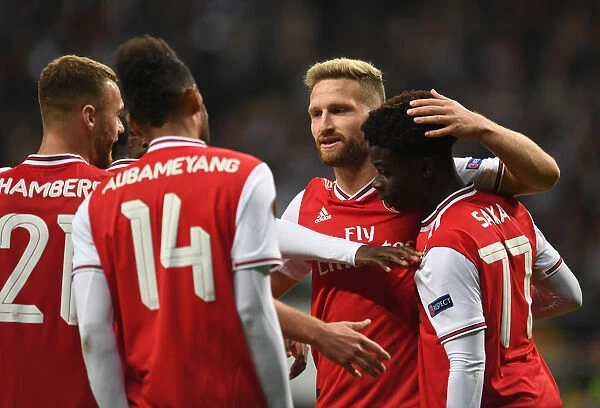 Arsenal's Triumph over Eintracht Frankfurt in Europa League: Mustafi Celebrates Third Goal