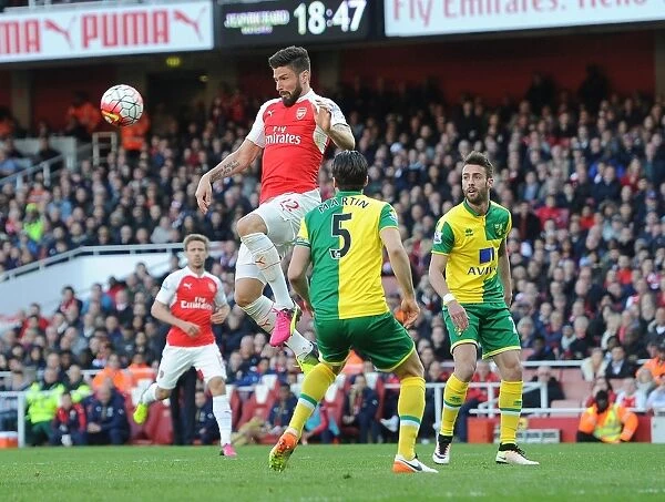 Giroud vs Martin: A Battle for the Ball at Arsenal vs Norwich City, Premier League 2015-16