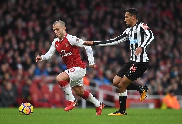 Intense Rivalry: Wilshere vs. Hayden Clash in Arsenal vs. Newcastle Football Match