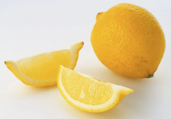 Whole lemon and two wedges