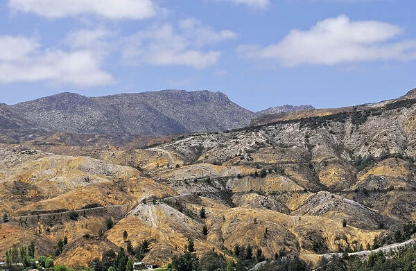Hills eroded after deforestation and air pollution for copper mining near Queenstown, Lunar Landscape, Tasmania, Australia