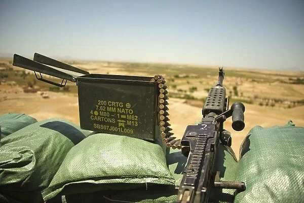 A M240B medium machine gun is positioned at an observation post