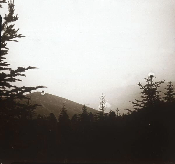 Landscape, smoke in distance, Alsace, c1914-c1918