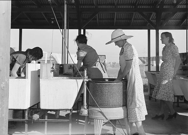 Laundry facilities in FSA migrant labor camp, Westley, California, 1939. Creator: Dorothea Lange