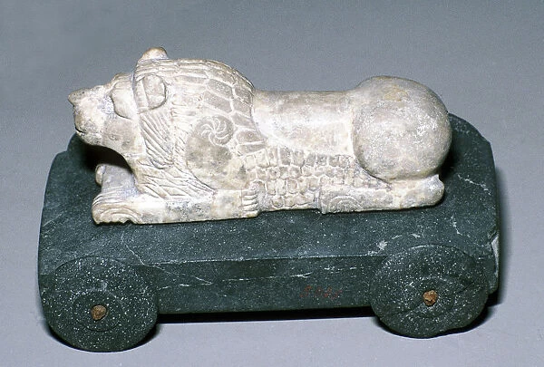 Limestone and bitumen lion mounted on a wheeled base, Susa, c12th century BC