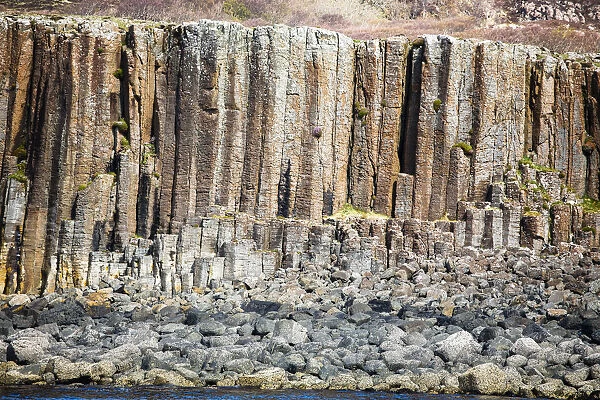 Basalt column formations and rocks at coastal area, Isle of Ulva, Scotland