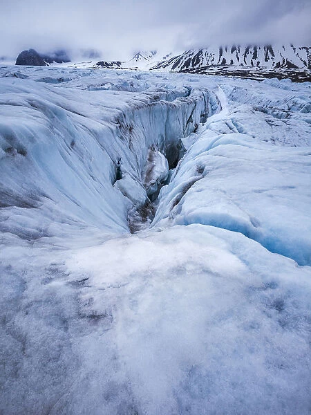 Glacial crevasse of coastal glacier, Krossfjorden, Spitsbergen, Svalbard, Norway