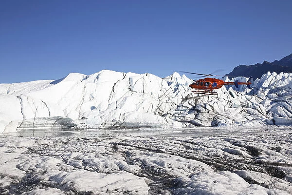 Rescue helicopter landing on the Matanuska Glacier, Alaska, United States