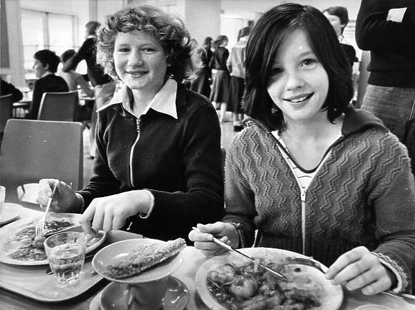 13 year old Helen Boldre and Gillian Cook tuck into their school dinners
