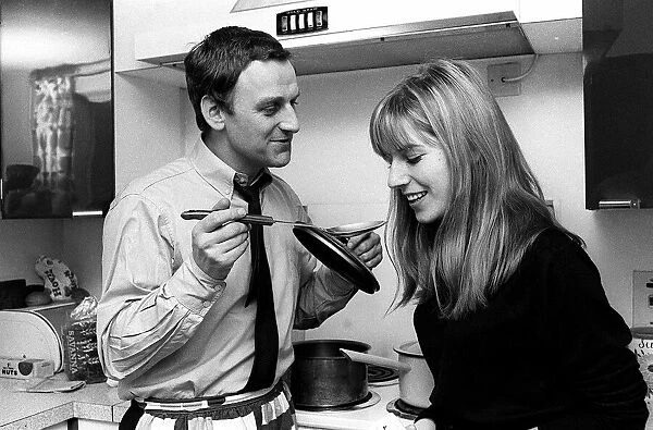 Actor John Thaw at home with wife Sally cooking 1966