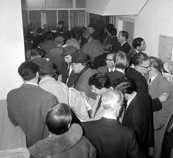 A crowded betting shop in Soho, packed with punters queuing to make bets May 1961