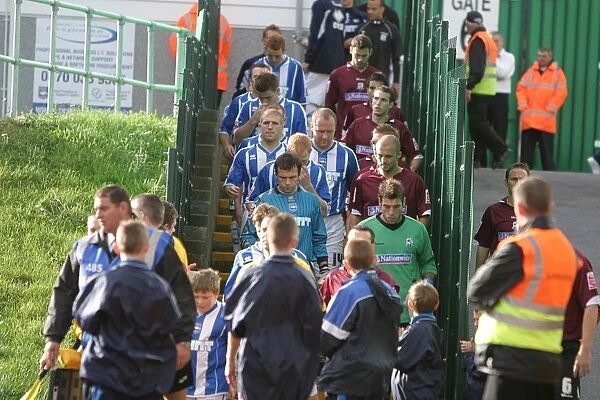 the Albion & Northampton teams leave the Withdean dressing rooms