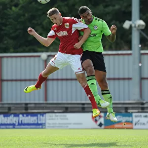 Bristol City's Wes Burns and Forest Green Rovers Jamie Turley Battle for High Ball in Preseason Clash