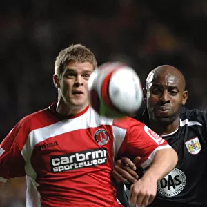 Dele Adebola chases Charltons Martin Cranie for the ball