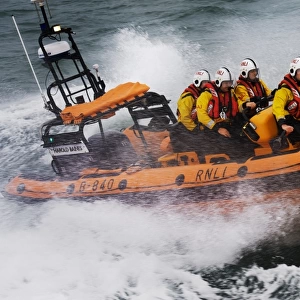 Atlantic 85 inshore lifeboat Harold Baines B-840 during a training exercise in Poole bay. Crew wearing new lifejackets