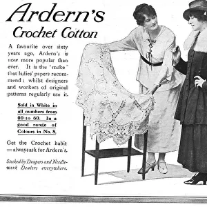 Two models discussing a fabric held out by the draper. Advert for Arden's Crochet Cotton. Date: 1918