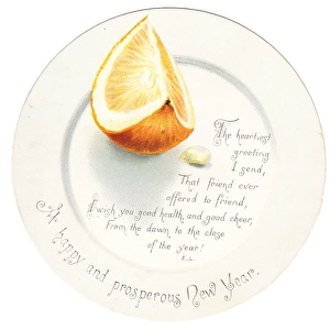 Orange segment on a plate-shaped New Year card