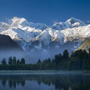 New Zealand, Westland, Westland National Park. Mt Cook and Mt Tasman reflected in the still waters of