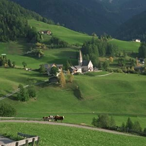 Church, houses and farmland in the Val di Funes in the Dolomites
