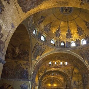 Interior of St. Marks Basilica (Basilica di San Marco) with golden Byzantine mosaics illuminated, Venice, UNESCO World Heritage Site, Veneto