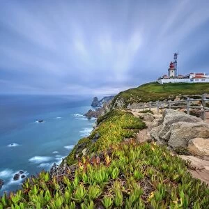 Sunrise on the cape and lighthouse of Cabo da Roca overlooking the Atlantic Ocean