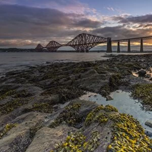 Sunrise through the Forth Rail Bridge, UNESCO World Heritage Site, on the Firth of Forth