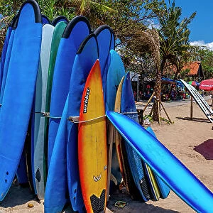 View of colourful sunshades and surf boards on sunny morning on Kuta Beach, Kuta, Bali, Indonesia, South East Asia, Asia