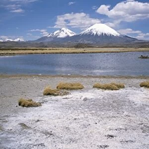 Volcan Parinacota (6330m) on right, Volcan Pomerape (6240m) on left, volcanoes in the Lauca National Park, Andes mountains, Chile