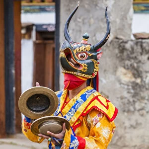 Masked dancer at a local festival in Paro District, Bhutan