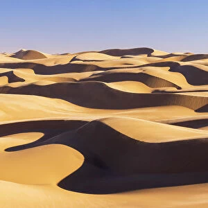 Namibia, Walvis Bay, Namib desert sand dunes reaching the ocean