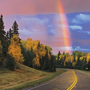 Canada, Saskatchewan, Prince Albert National Park. Rainbow after storm. Credit as