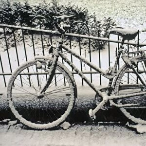 Europe, The Netherlands, Amsterdam. A snow-covered bicycle in Amsterdam in winter