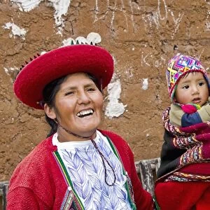 Family with baby in traditional dress in Cusco Cuzco Peru South America (MR)