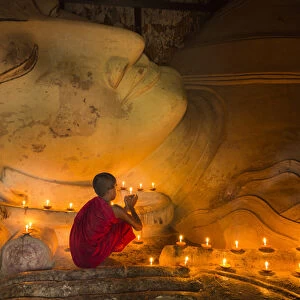 Myanmar, Bagan. Young monk at Shinbinthalyaung Temple Reclining Buddha