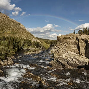 USA, Montana, Glacier National Park. Rainbow above Swiftcurrent Falls