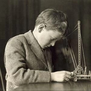 A boy playing with mechanical toy. Photograph by Lewis Hine, c1924