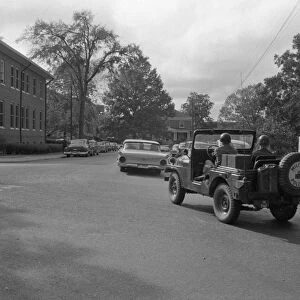 INTEGRATION: OLE MISS, 1962. A military jeep escorting the car carrying James Meredith