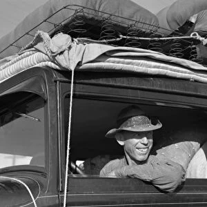 MIGRANT WORKER, 1939. Migrant cotton picker, photographed along Highway 99 between Tulare