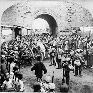 RUSSO-JAPANESE WAR, c1905. Russian soldiers passing through the gates of Mukden